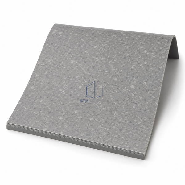 STJH coated-inlaid multilayer vinyl flooring sample with matte face and curved edge revealing its layered backing on white