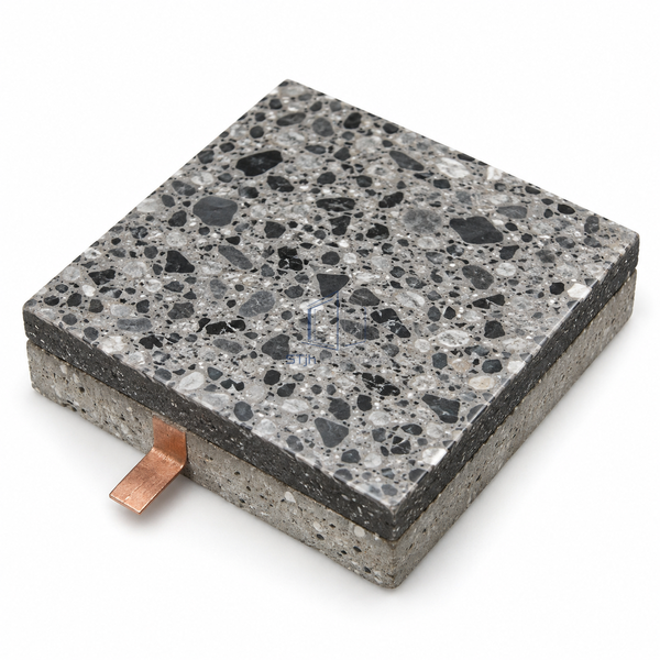 STJH conductive epoxy terrazzo sample with dark matrix, mineral chips and complete cut edges on white